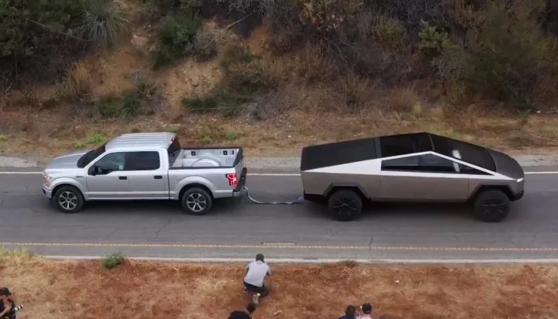 Tesla Cybertruck Tows Ford F-150 Up a Hill in Tug of War Video 1